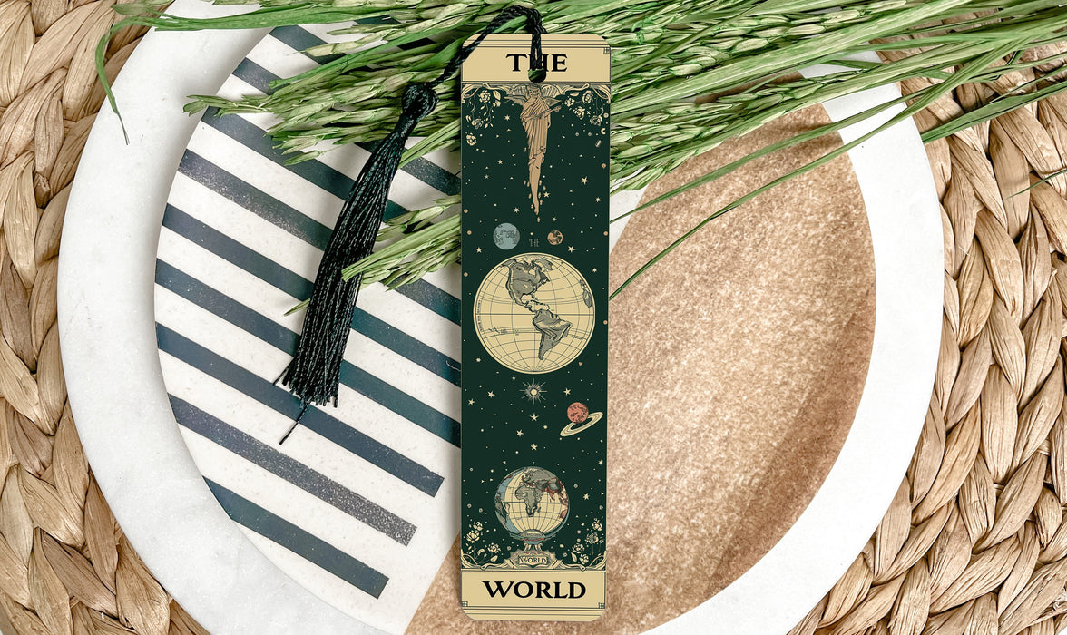a bookmark on a plate with a plant on it