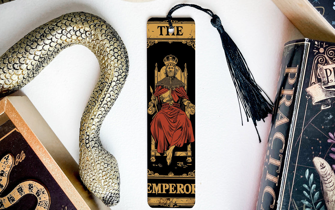a snake, a bookmark, and a book on a table