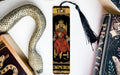 a snake, a bookmark, and a book on a table
