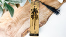 a bookmark with a tassel hanging from it
