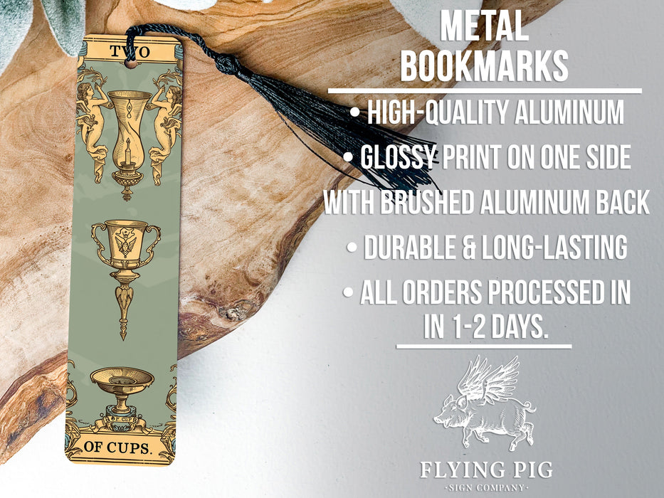 a metal bookmark with a tassel on top of it