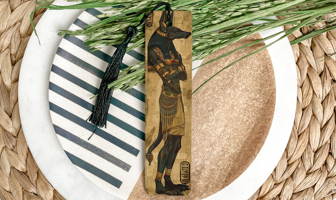 a wooden bookmark with a picture of an egyptian god