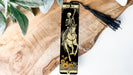 a bookmark with a skeleton riding a horse