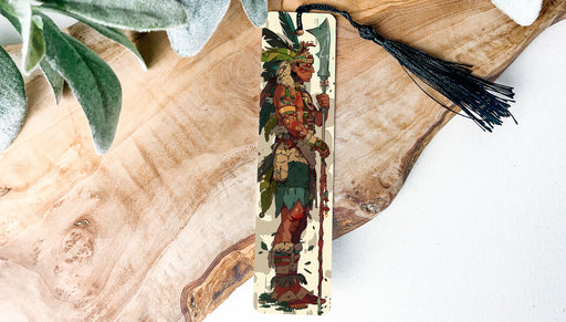 a wooden cross with a tassel hanging from it
