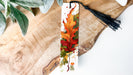 a bookmark with a picture of a leaf on it