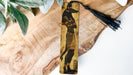 a wooden bookmark with a picture of an egyptian god