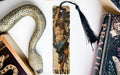 a bookmark with a picture of a man and a snake on it