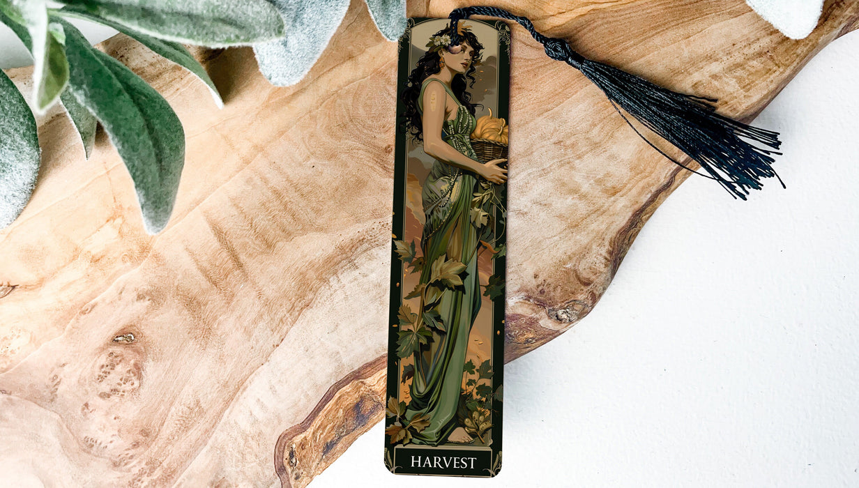 a bookmark with a picture of a woman in a green dress