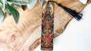 a wooden cross with a tassel hanging from it