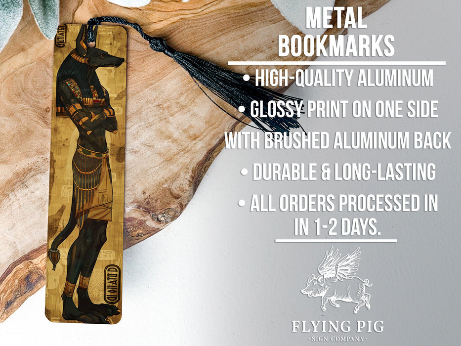 a wooden bookmark with an egyptian scene on it