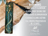 a metal bookmark with an image of a mermaid on it
