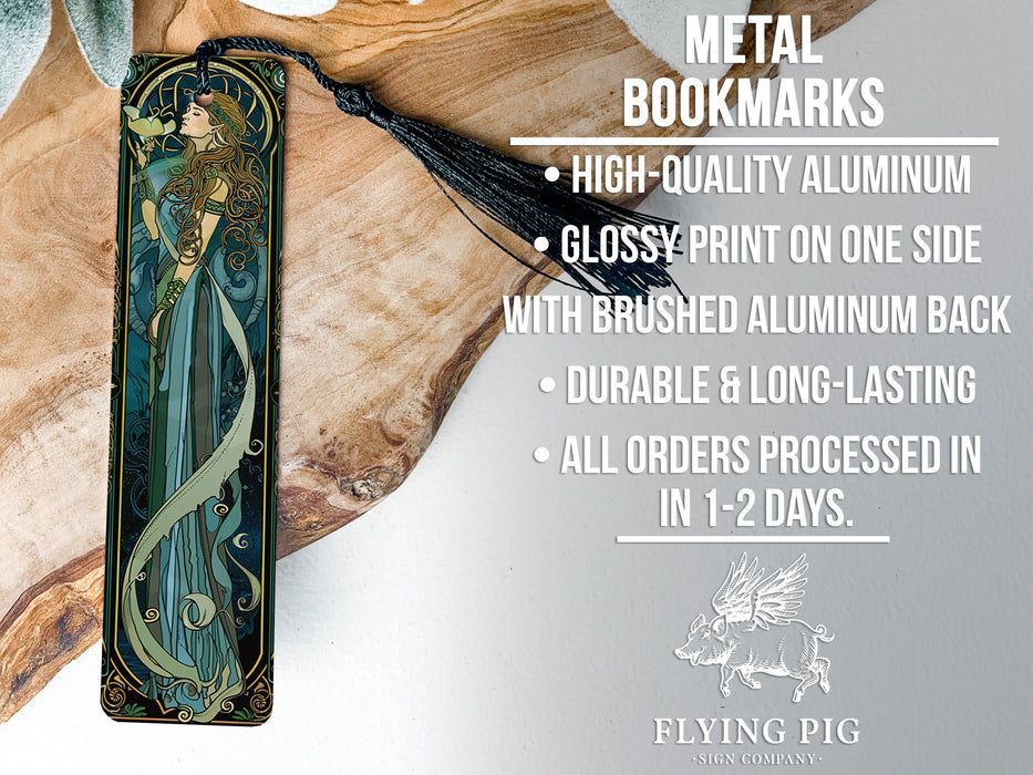 a metal bookmark with an image of a mermaid on it