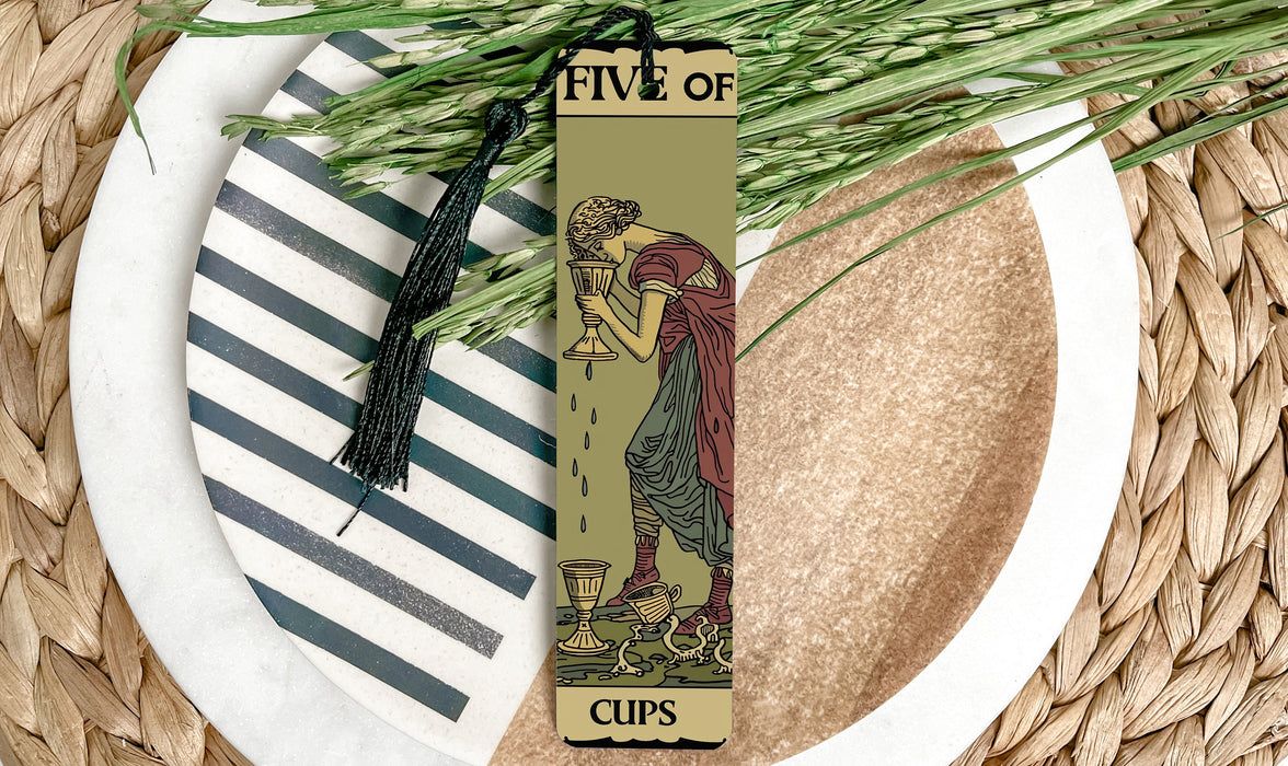 a bookmark with a picture of a woman holding a cup