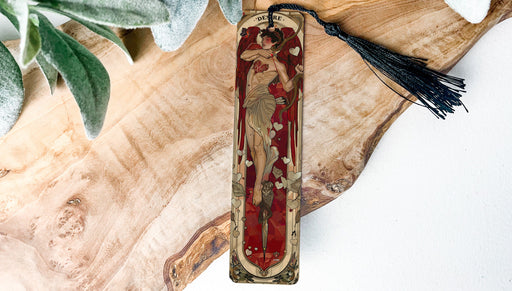 a wooden cross with a tassel hanging from it