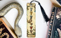 a snake, a bookmark, and some books on a table