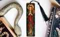 a bookmark with an image of a woman and a snake on it