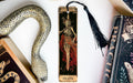 a bookmark with a skeleton on it next to a snake