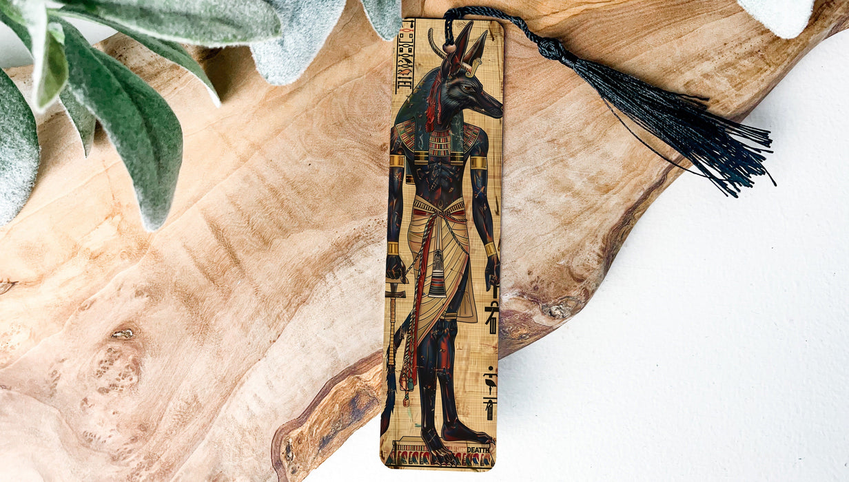 a piece of wood with a painting of an egyptian god on it