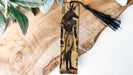 a piece of wood with a painting of an egyptian god on it