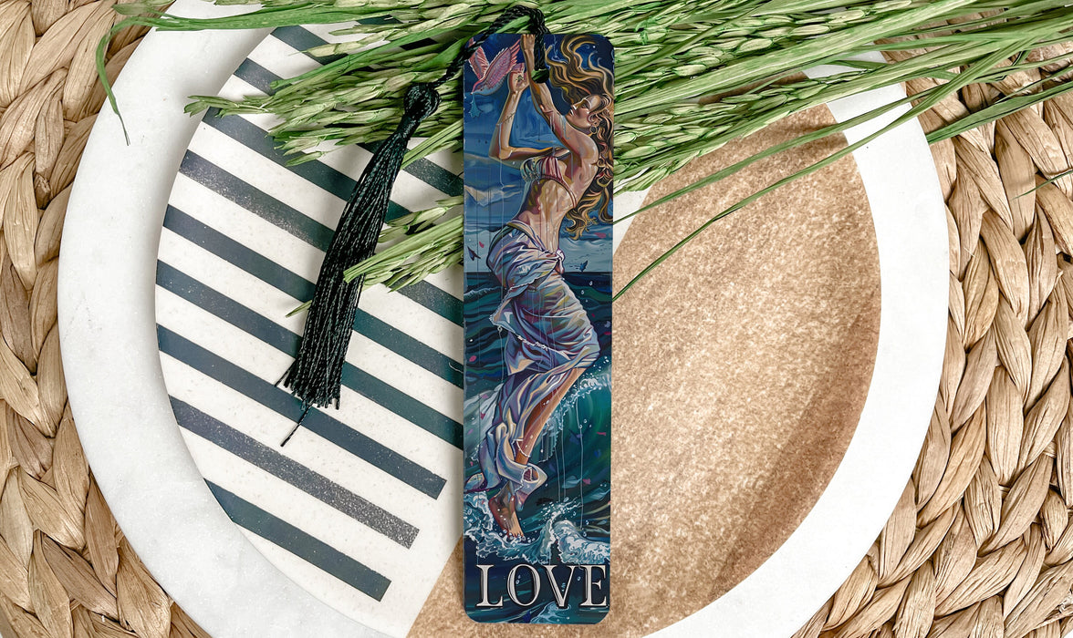 a bookmark with a picture of a mermaid on it