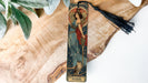 a bookmark with an image of a woman and a cat on it