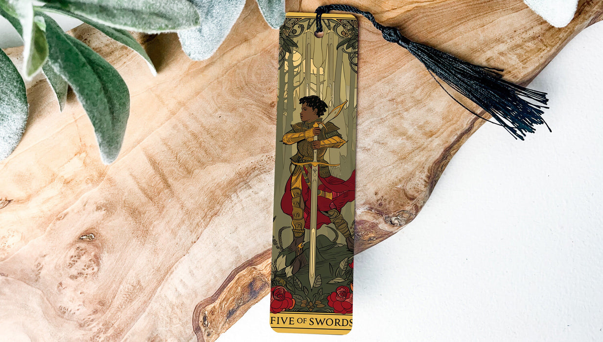 a bookmark with a picture of a woman holding a sword