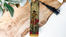 a bookmark with a picture of a woman holding a sword