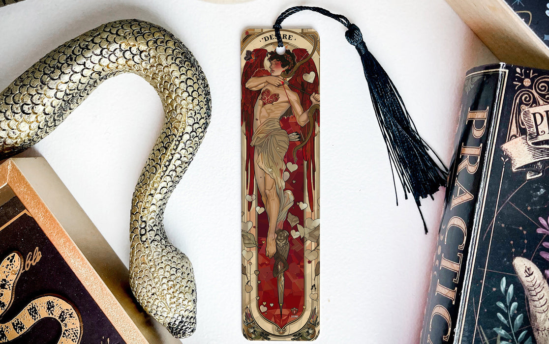 a bookmark, snake, and other items on a table