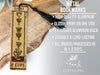a metal bookmark with a tassel hanging from it