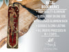 a cross with a tassel hanging from it