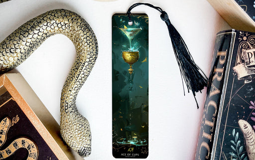 a bookmark with a picture of a martini glass and a snake