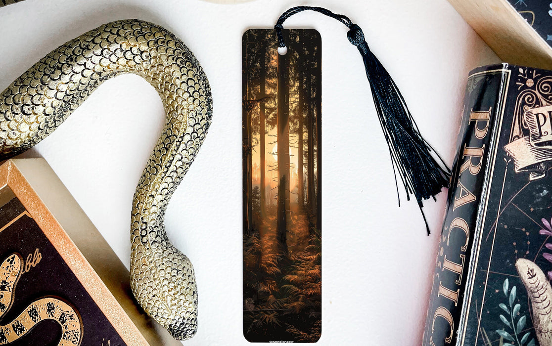 a bookmark with a snake on it next to other books