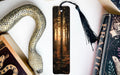 a bookmark with a snake on it next to other books