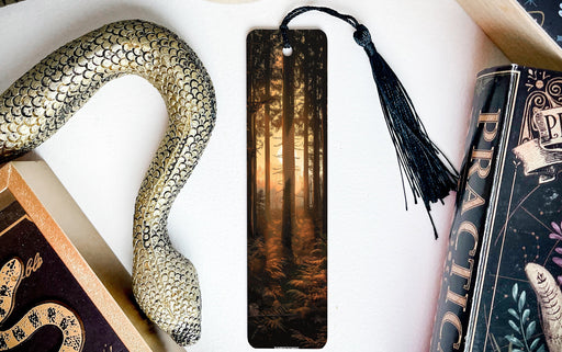 a bookmark with a snake on it next to other books
