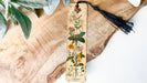 a bookmark with a tassel hanging from it