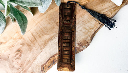 a piece of wood with a tassel on top of it