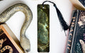a snake, bookmarks, and other items on a table