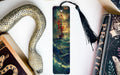 a bookmark with a painting of a ship on it