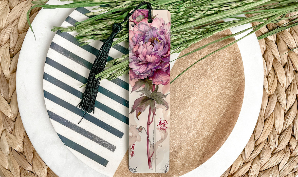 a plate with a flower and a bookmark on it