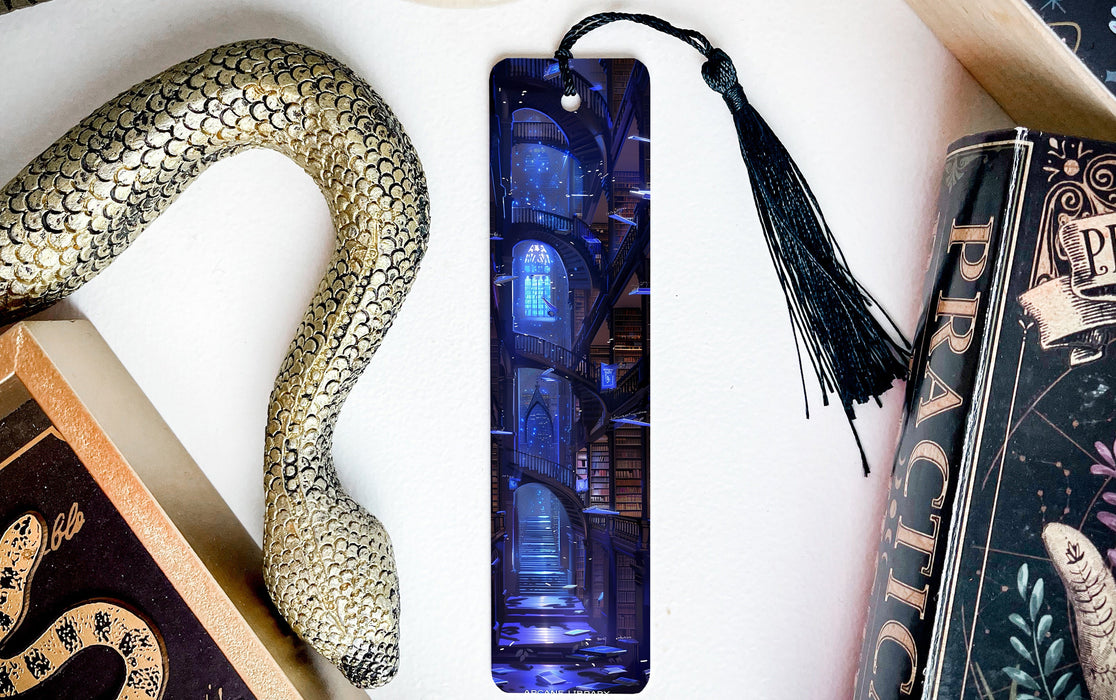 a bookmark with a snake on it next to other books
