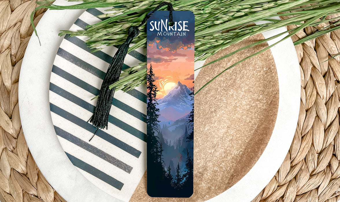 a bookmark sitting on top of a plate next to a plant