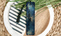 a bookmark with a picture of a ship on it
