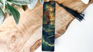 a bookmark with a painting of a ship on it