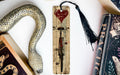 a snake, a bookmark, and some books on a table