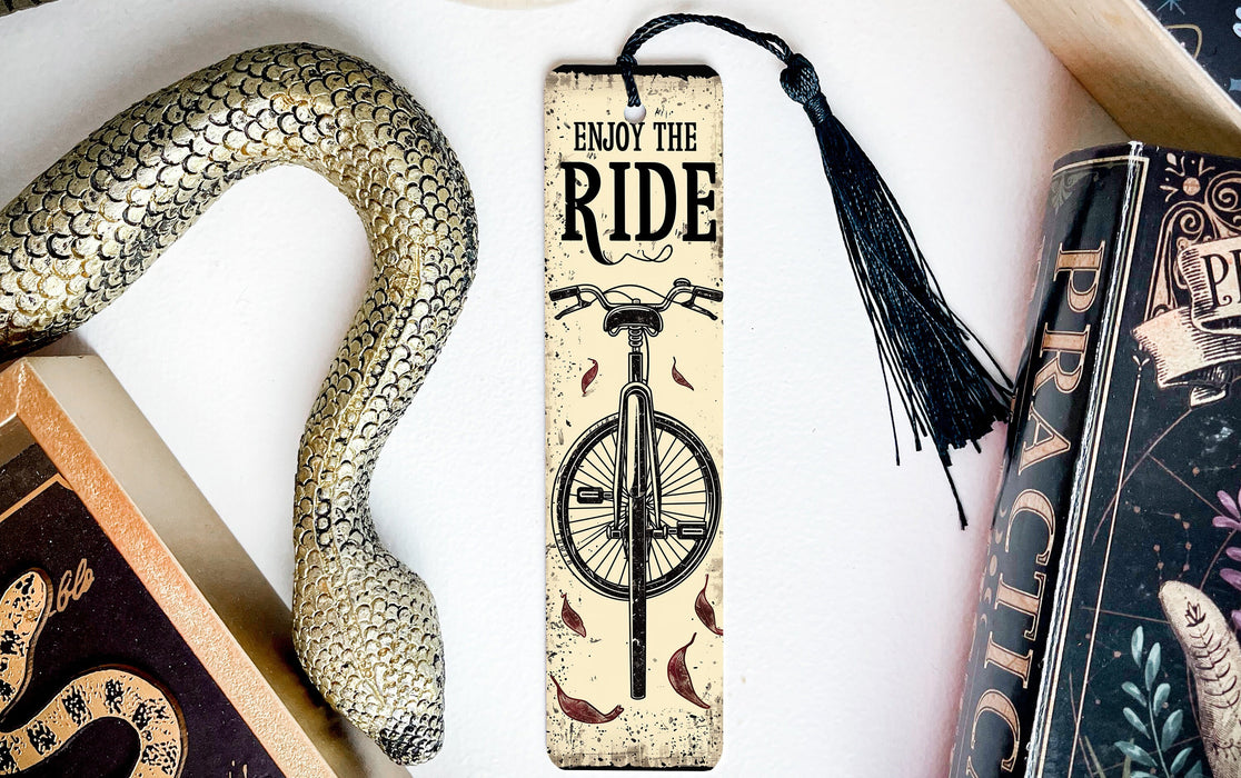 a bookmark with a snake and a bike on it