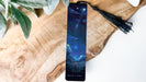 a bookmark with a picture of a night sky