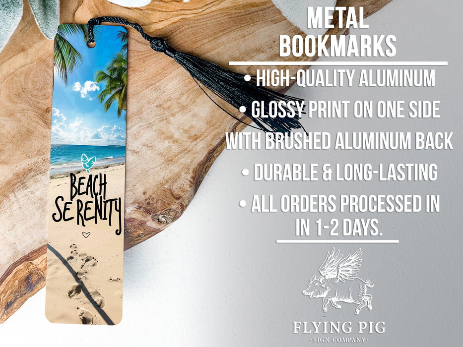 a metal bookmark with a beach scene on it