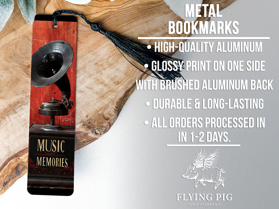 a metal bookmark with a bell on top of it