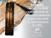 a metal bookmark with a forest scene on it