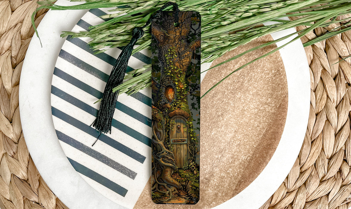 a bookmark on a plate next to a plant